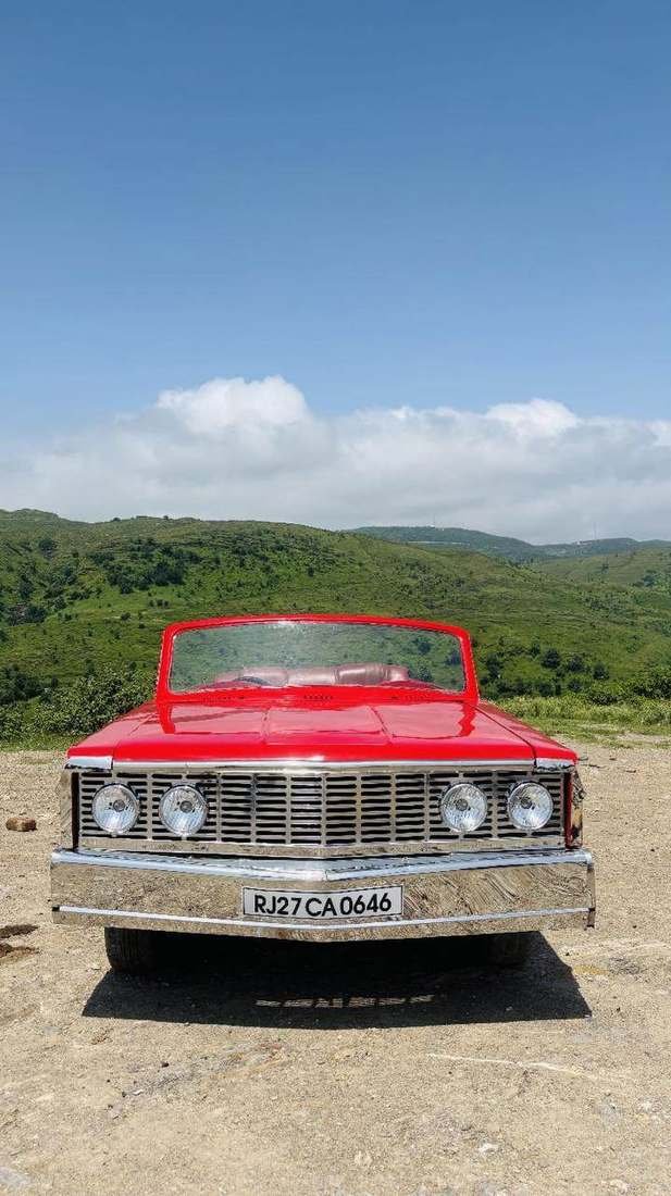 Red Contessa vintage convertible for wedding and pre-wedding booking in Udaipur